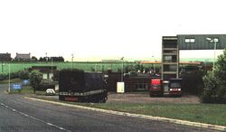 Old lorry park with the base of a bridge.