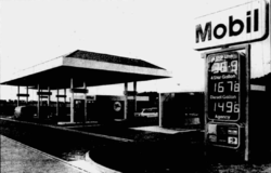 Black and white photo of a Mobil filling station.