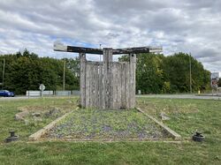 A canal lock in the middle of a roundabout.