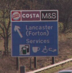 Motorway sign saying: BK Costa M&S, Lancaster (Forton) services.