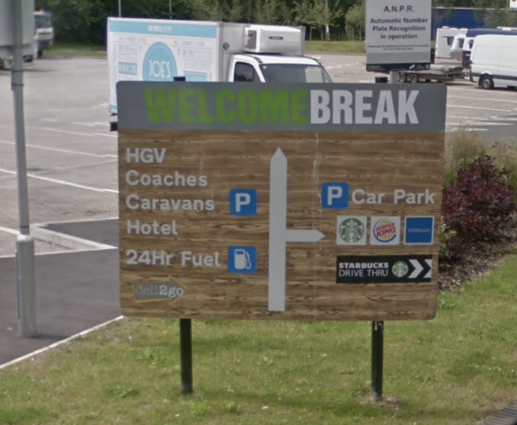 File:Welcome Break wood effect signage.png
