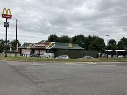 A McDonald's restaurant, viewed across a road.