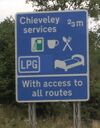 Motorway A-road services sign.