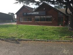Brick restaurant building with the Cappadocia sign on it.