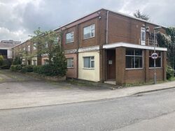 Two-storey, brick hotel building.