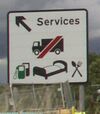 White services sign with symbols.