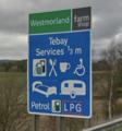 Sign saying 'Westmorland farm shop, Tebay services'.