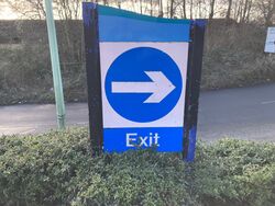Turn right sign with a blue swerve on top.