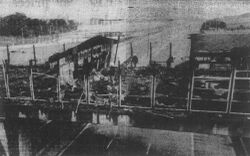 The fire-damaged building above the motorway.