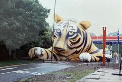 Large inflatable tiger placed on the road in front of an Esso forecourt.