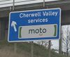Sign saying 'Cherwell Valley services - Moto' on left.
