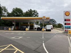 The entrance to a Shell-branded forecourt.