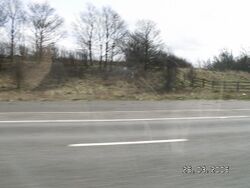 A wide section of motorway hard shoulder, indicated an unfinished exit.