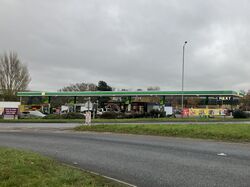 A BP forecourt, viewed from across a road.