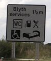 Sign saying 'Blyth services'.