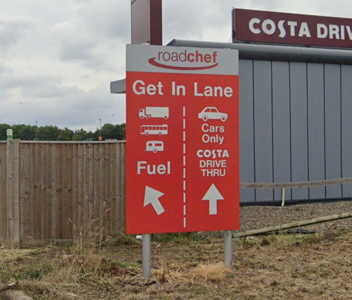 File:Strensham red Roadchef lane sign.png