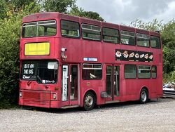 A red double decker bus which says Eat On The Bus.