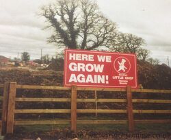'Here we grow again' sign.