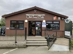 A hut building branded Old Inns Café.
