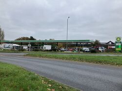 A BP forecourt, viewed from across a road.