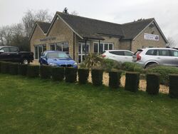 Cars parked outside a building.