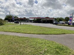 Two Esso petrol stations next to each other.