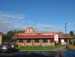 Large brick restaurant building with signs saying Little Chef and Burger King.